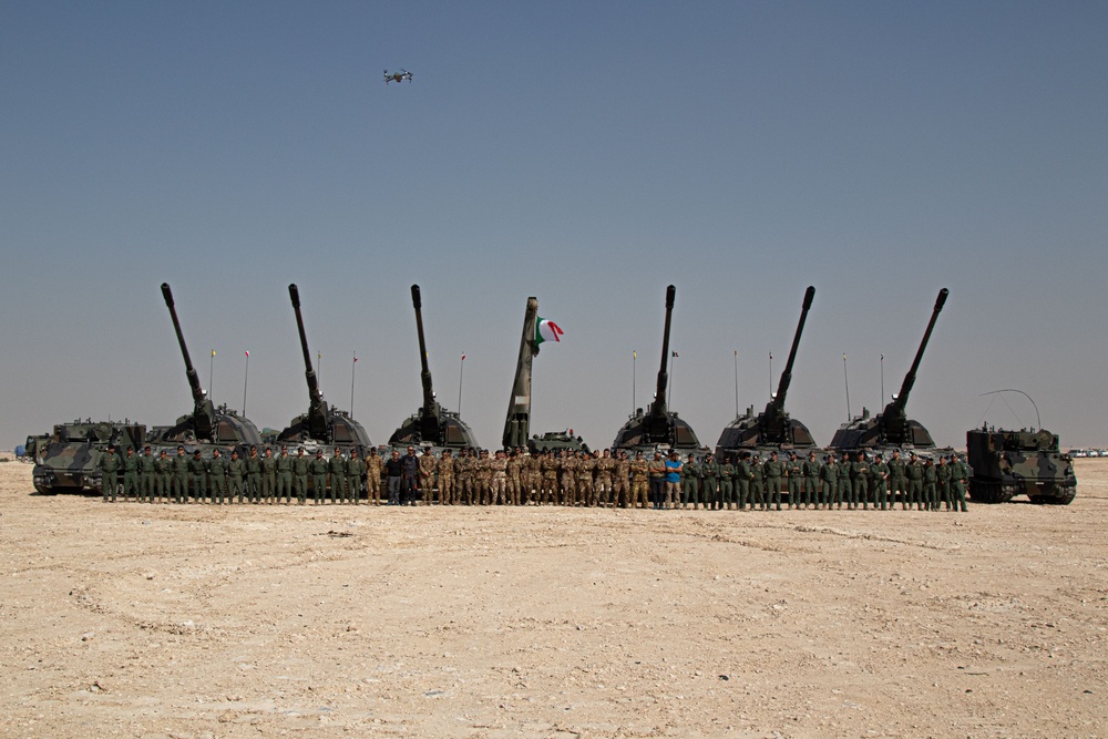 Italian Army soldiers pose with their equipment during Exercise Ferocious Falcon 5