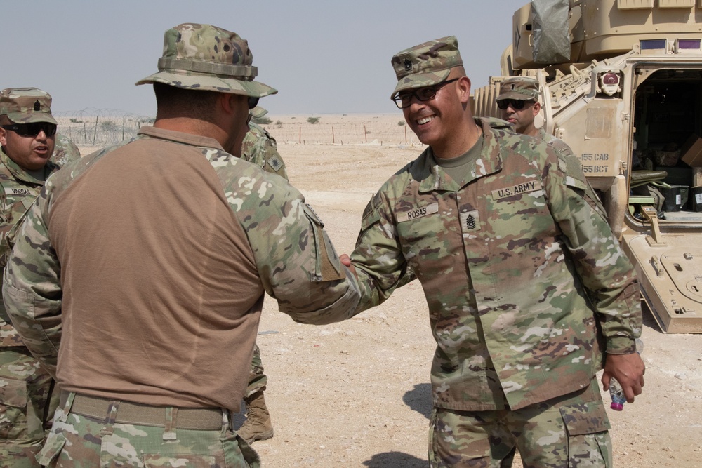 U.S. Army Command Sgt. Maj Refugio Rosas Jr, Task Force Spartan Command Sergeant Major, greets the leadership from Task Force Commando