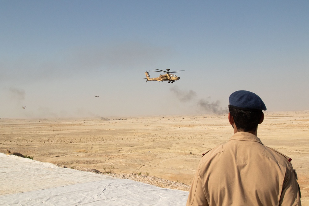 Qatari Armed Forces fire rounds from their Apache AH-64 helicopters during Exercise Ferocious Falcon 5