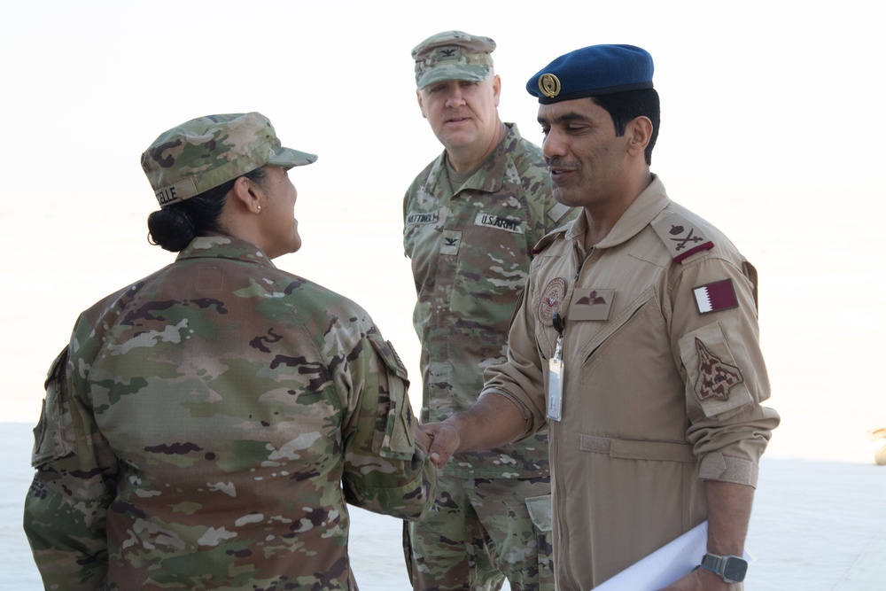 U.S. Army Brig. Gen. Marlena DeCelle, Deputy Commanding General-Support of Task Force Spartan, greets a Qatari Emiri Air Force pilot during Exercise Ferocious Falcon 5