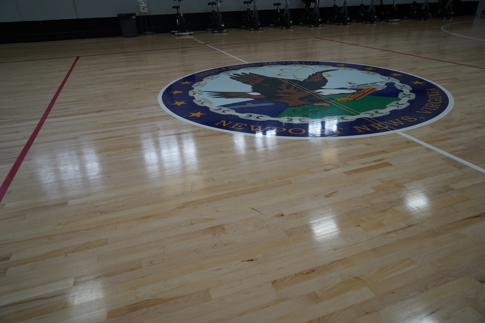 Newly refinished basketball gym floor at Huntington Hall Naval Berthing Facility