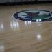 Newly refinished basketball gym floor at Huntington Hall Naval Berthing Facility