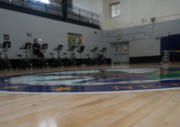 Newly refinished basketball gym floor at Huntington Hall Naval Berthing Facility