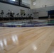 Newly refinished basketball gym floor at Huntington Hall Naval Berthing Facility