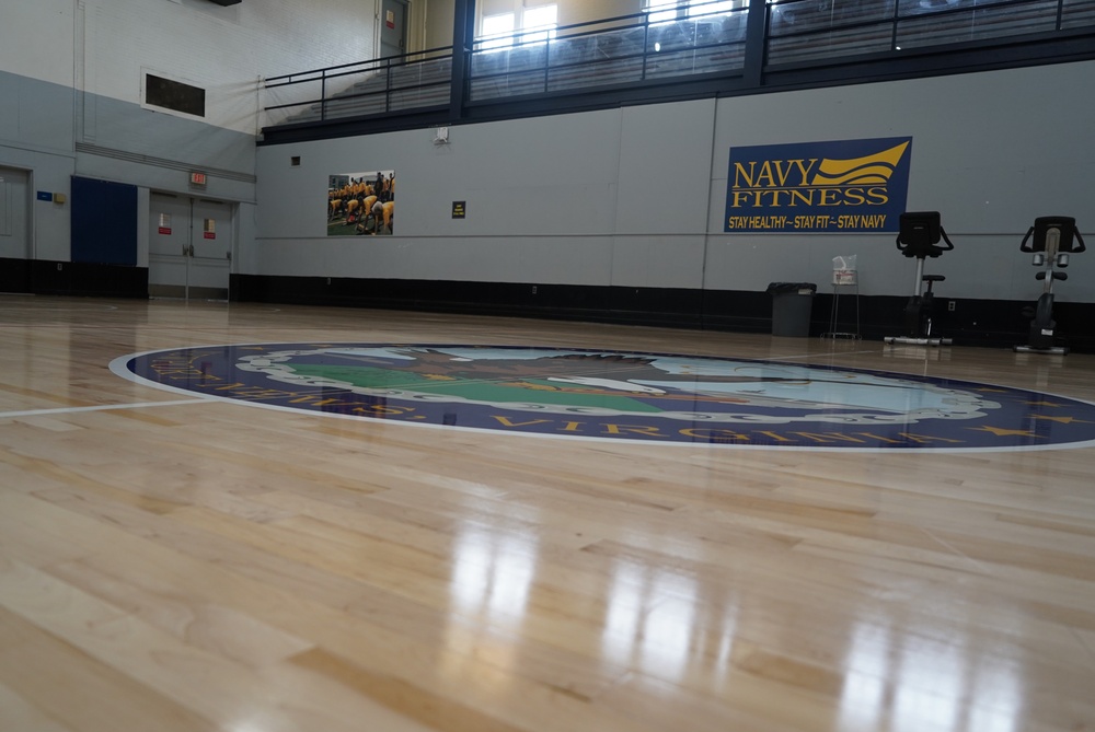 Newly refinished basketball gym floor at Huntington Hall Naval Berthing Facility