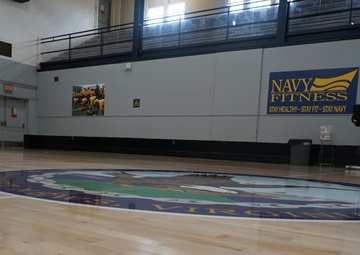 Newly refinished basketball gym floor at Huntington Hall Naval Berthing Facility