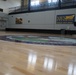 Newly refinished basketball gym floor at Huntington Hall Naval Berthing Facility