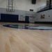 Newly refinished basketball gym floor at Huntington Hall Naval Berthing Facility