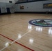 Newly refinished basketball gym floor at Huntington Hall Naval Berthing Facility