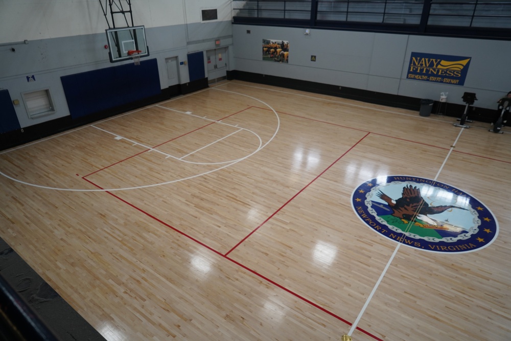 Newly refinished basketball gym floor at Huntington Hall Naval Berthing Facility