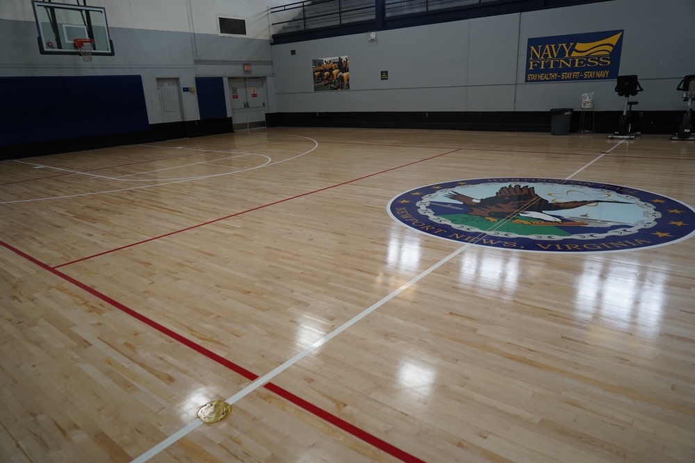 Newly refinished basketball gym floor at Huntington Hall Naval Berthing Facility