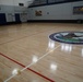 Newly refinished basketball gym floor at Huntington Hall Naval Berthing Facility