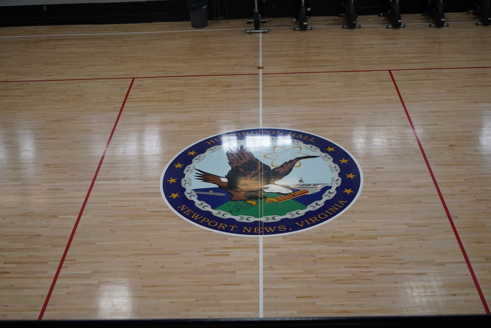 Newly refinished basketball gym floor at Huntington Hall Naval Berthing Facility