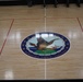 Newly refinished basketball gym floor at Huntington Hall Naval Berthing Facility