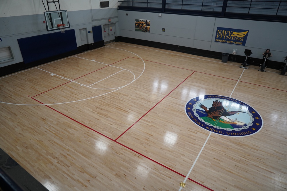 Newly refinished basketball gym floor at Huntington Hall Naval Berthing Facility