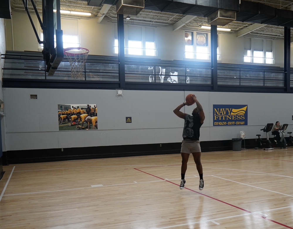 Newly refinished basketball gym floor at Huntington Hall Naval Berthing Facility