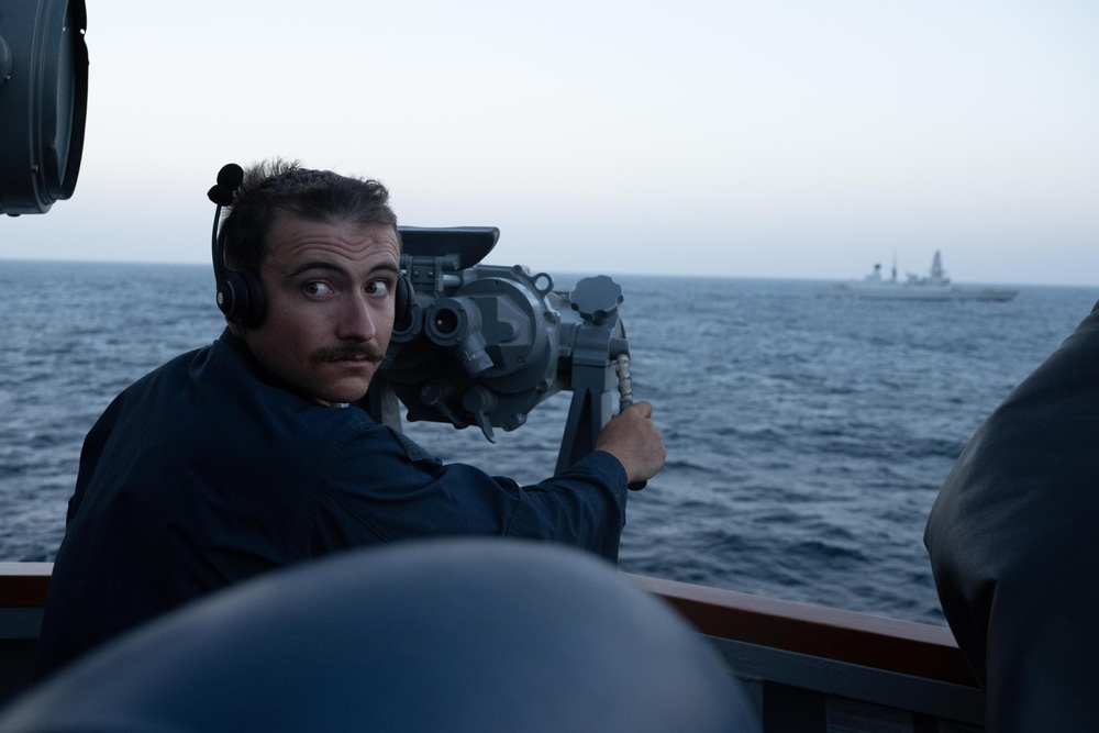 USS Mason Sails Alongside HMS Diamond During a Passenger Transfer in the Red Sea