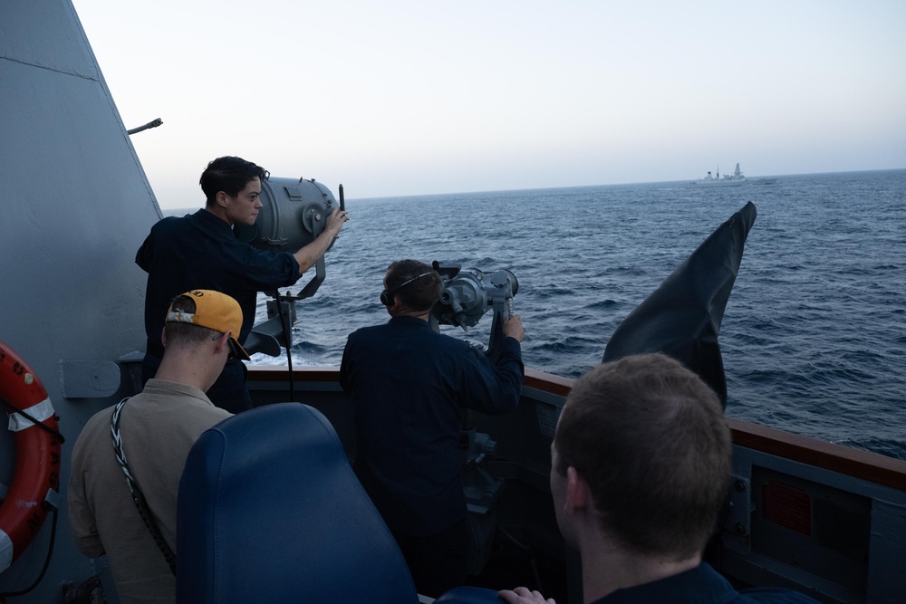 USS Mason Sails Alongside HMS Diamond During a Passenger Transfer in the Red Sea