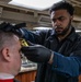 George Washington's barbershop gives haircuts to Sailors