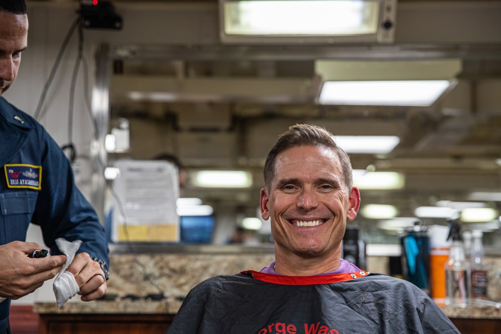 George Washington's barbershop gives a haircut to the Commanding Officer