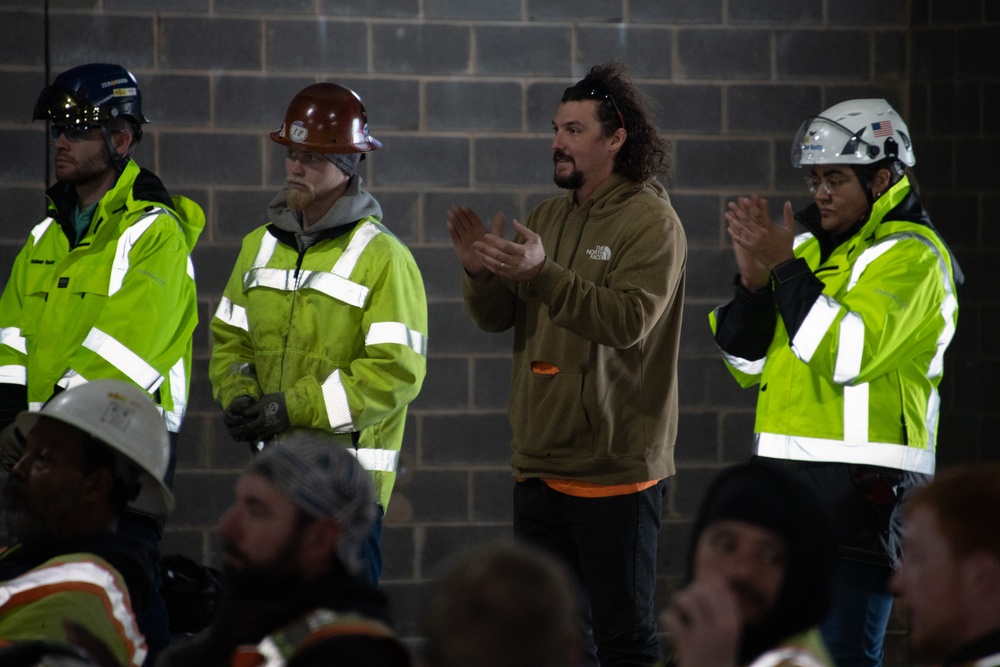 Team Andrews commemorates Consolidated Communications Center topping out ceremony