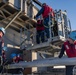 Sailors load a rolling airframe missile launcher