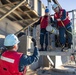 Sailors load a rolling airframe missile launcher