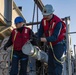 Sailors load a rolling airframe missile launcher