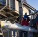 Sailors load a rolling airframe missile launcher