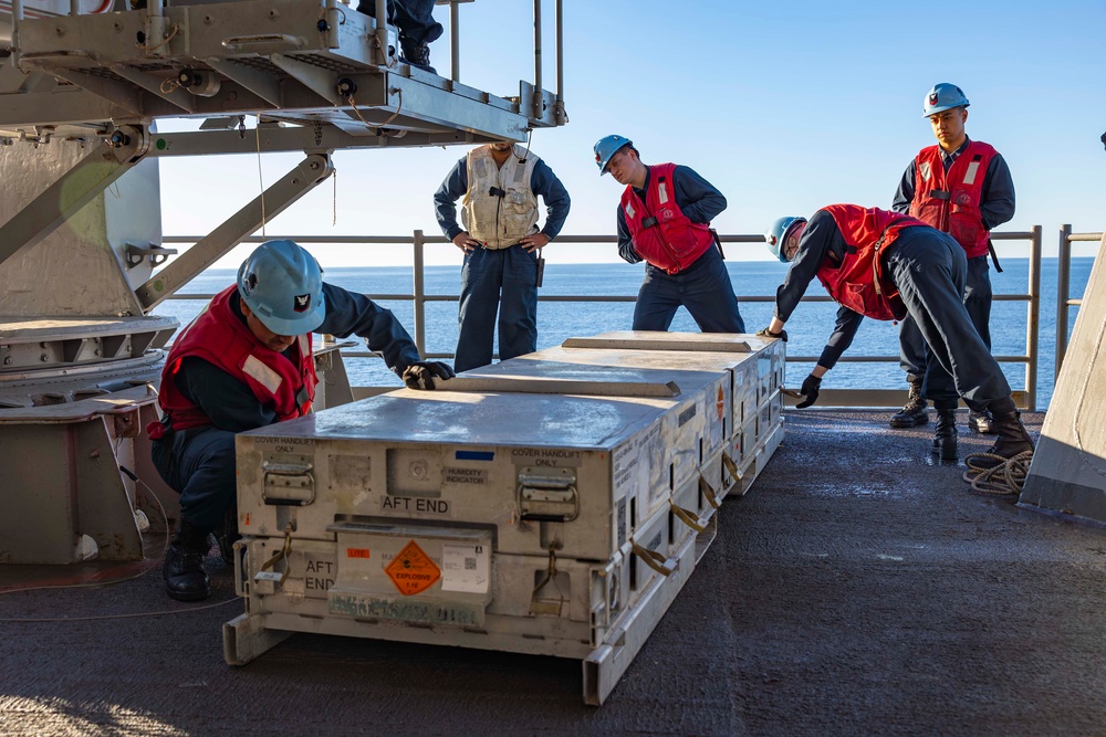 Sailors load a rolling airframe missile launcher