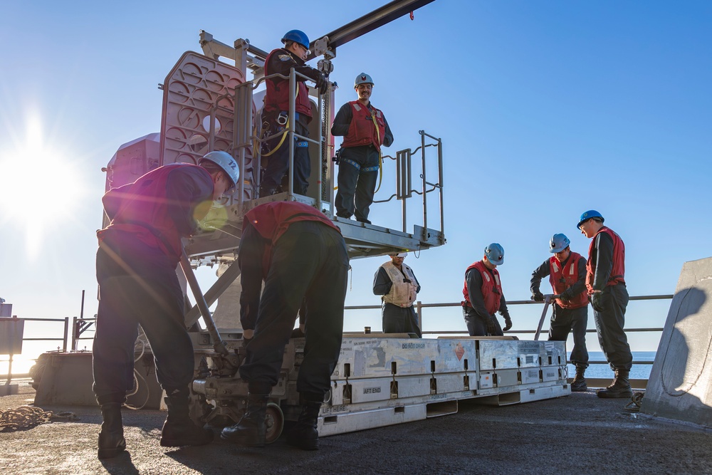 Sailors load a rolling airframe missile launcher