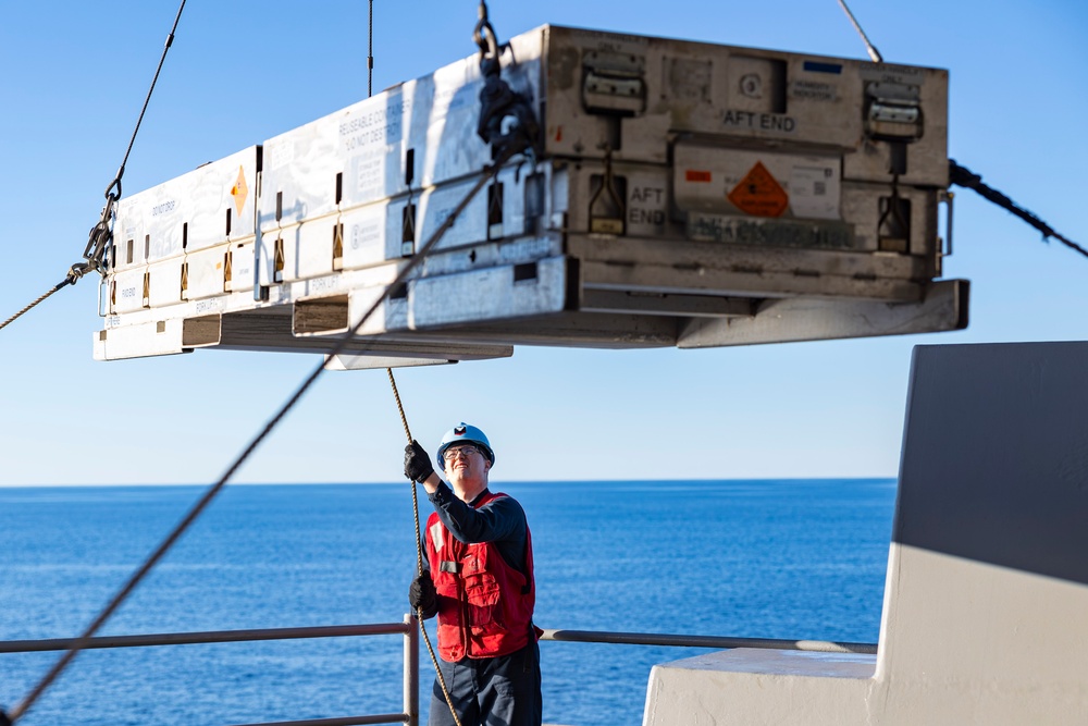 Sailors load a rolling airframe missile launcher