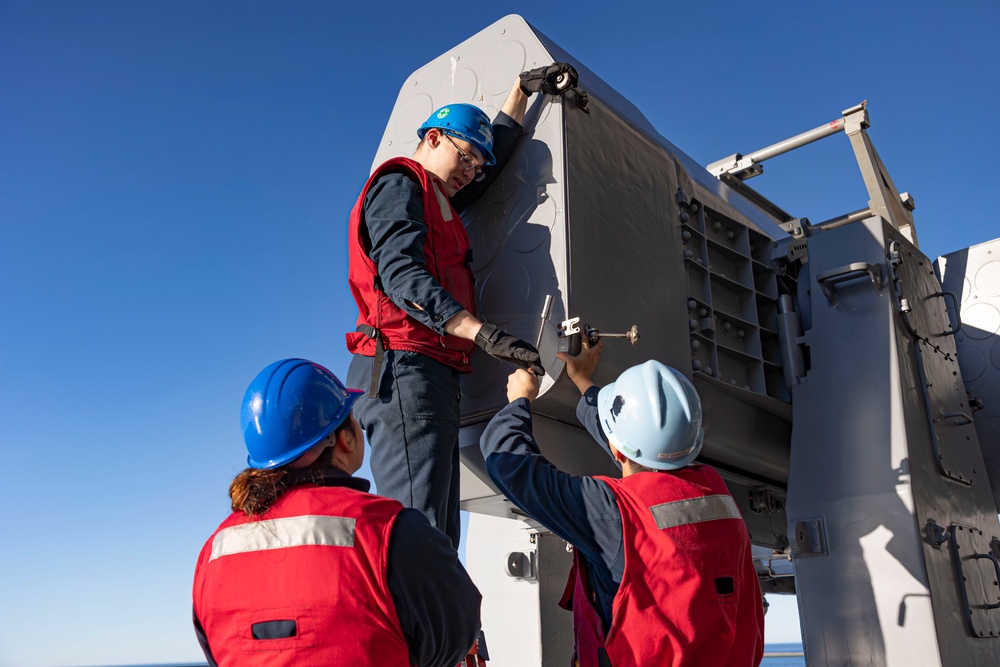 Sailors load a rolling airframe missile launcher