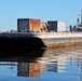 Decommissioned World War II-era fuel barge undergoing a maneuverability test to determine its towing capabilities.