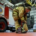 175th CES Firefighter Dons Turnout Gear