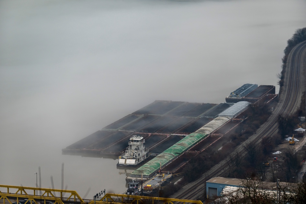 Towboats navigate through Pittsburgh District’s foggy landscape