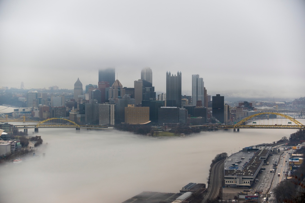 Towboats navigate through Pittsburgh District’s foggy landscape