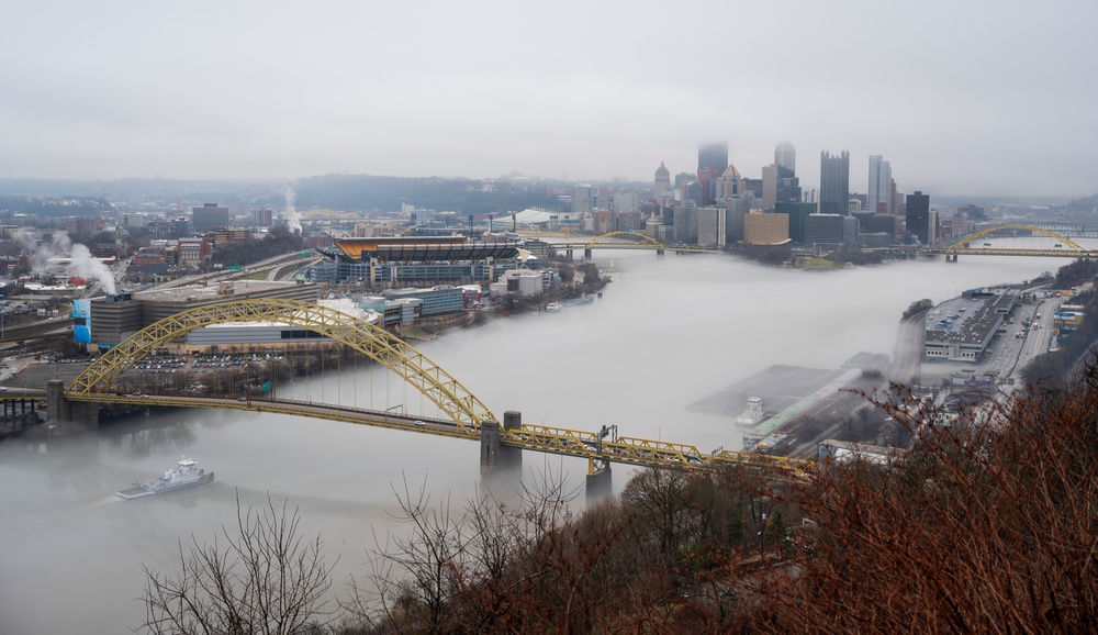 Towboats navigate through Pittsburgh District’s foggy landscape