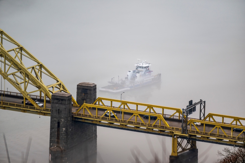 Towboats navigate through Pittsburgh District’s foggy landscape