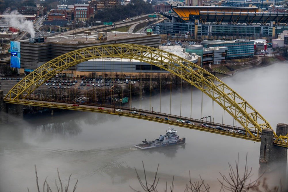 Towboats navigate through Pittsburgh District’s foggy landscape