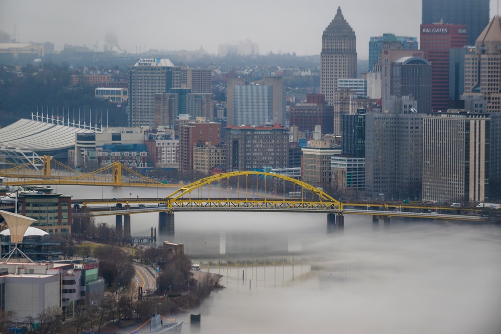 Towboats navigate through Pittsburgh District’s foggy landscape