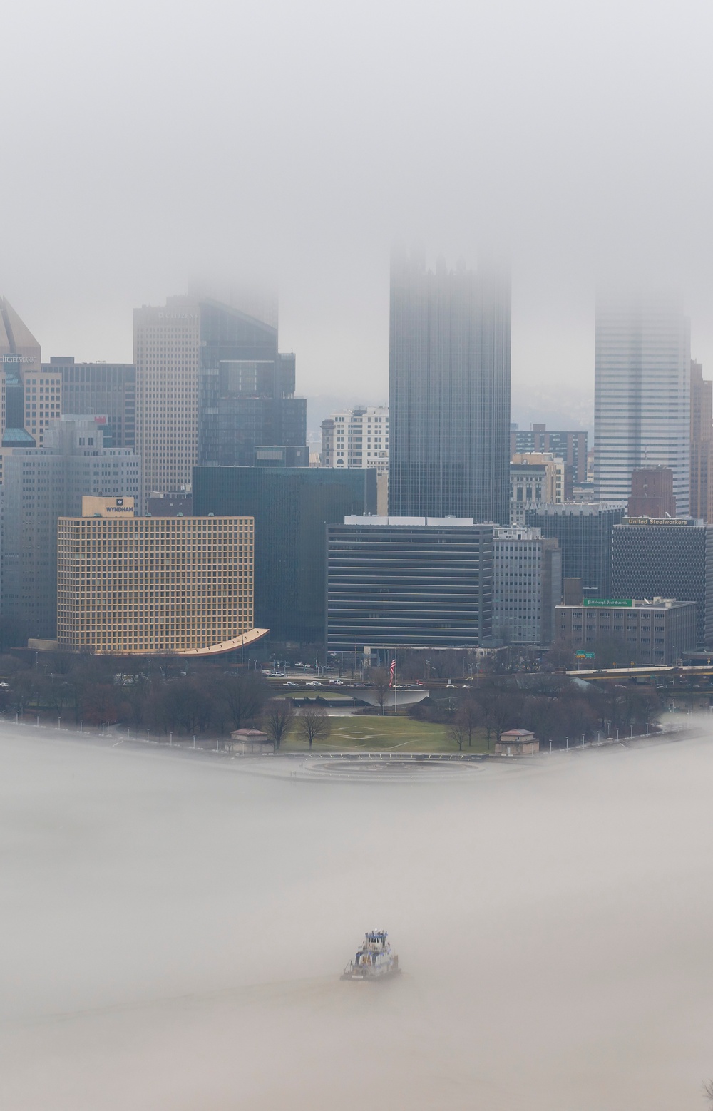 Towboats navigate through Pittsburgh District’s foggy landscape