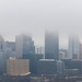 Towboats navigate through Pittsburgh District’s foggy landscape