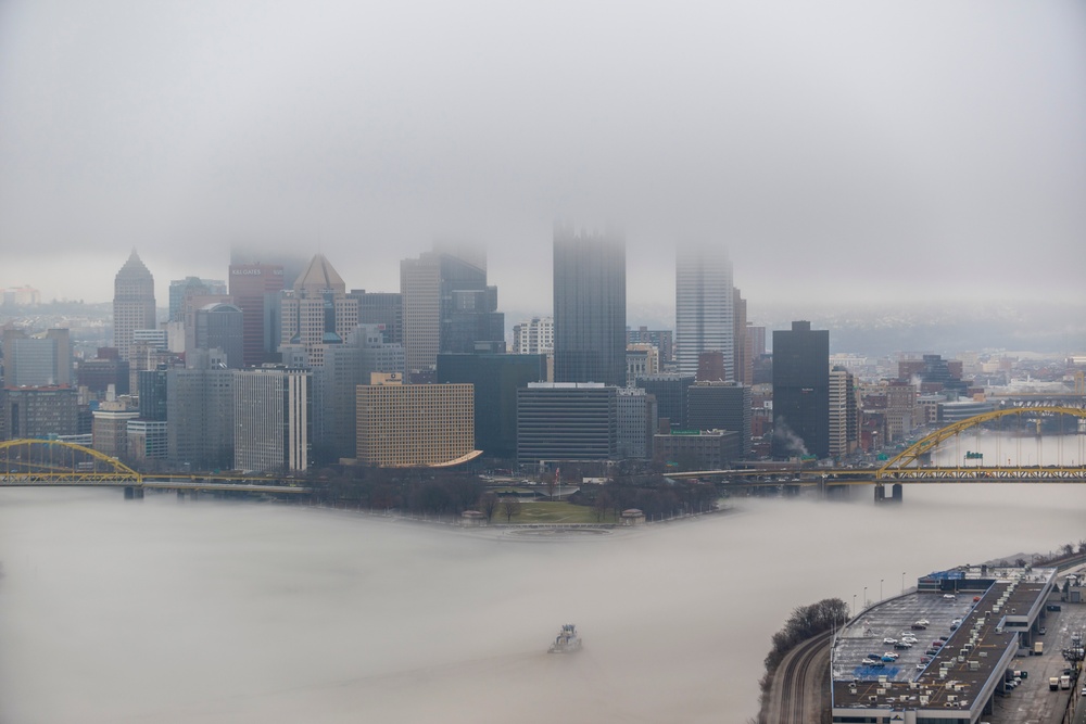 Towboats navigate through Pittsburgh District’s foggy landscape