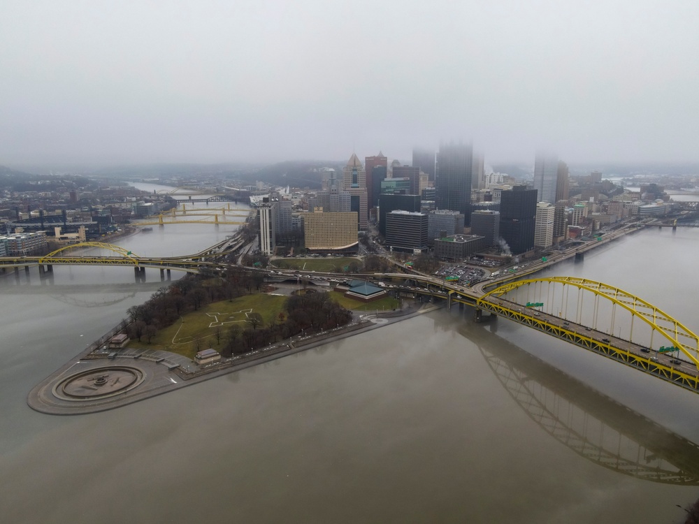 Towboats navigate through Pittsburgh District’s foggy landscape