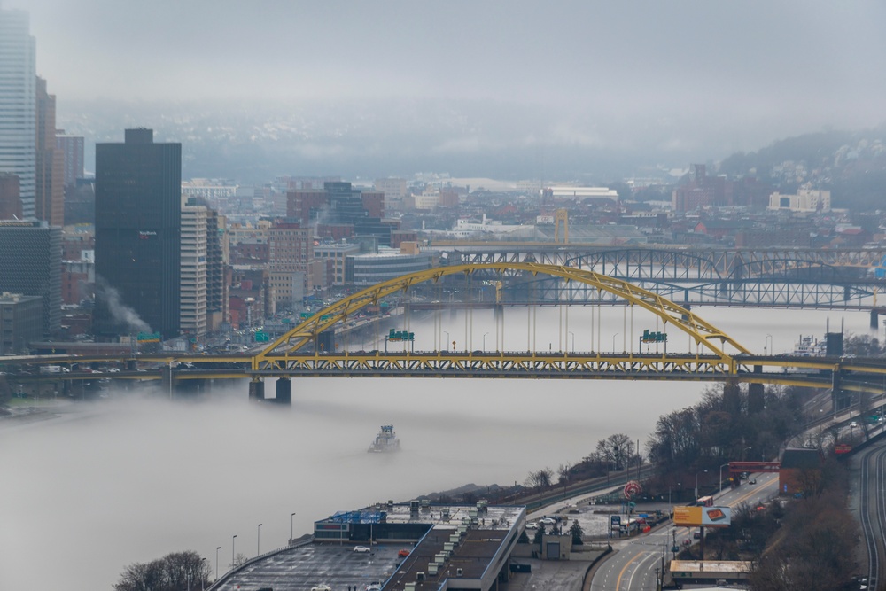 Towboats navigate through Pittsburgh District’s foggy landscape