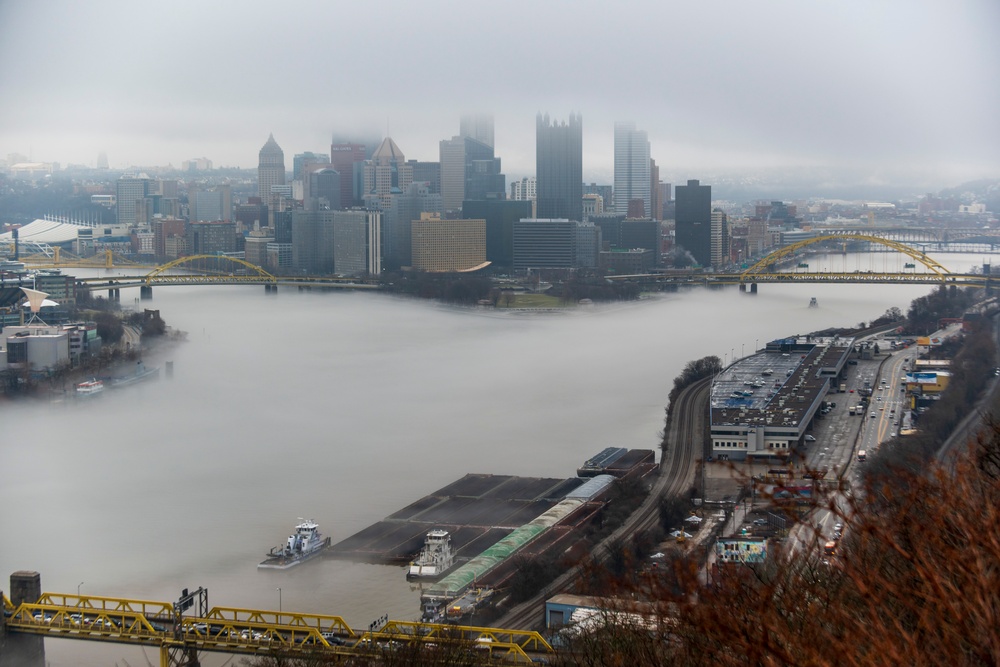 Towboats navigate through Pittsburgh District’s foggy landscape