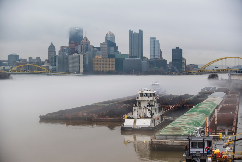 Towboats navigate through Pittsburgh District’s foggy landscape