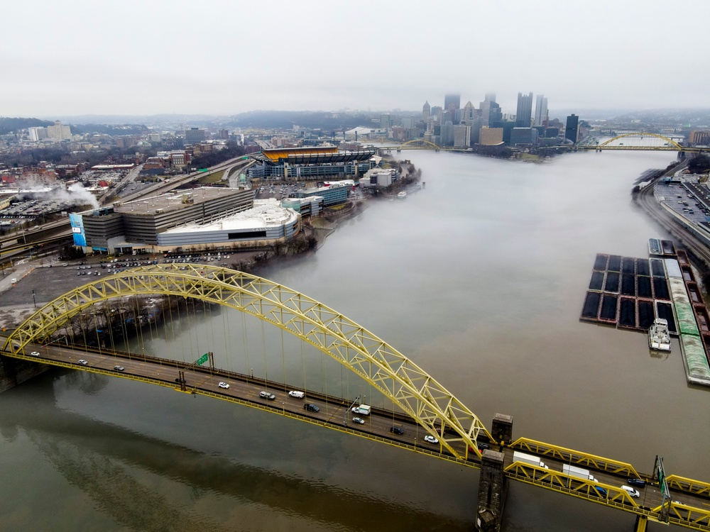 Towboats navigate through Pittsburgh District’s foggy landscape