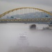 Towboats navigate through Pittsburgh District’s foggy landscape